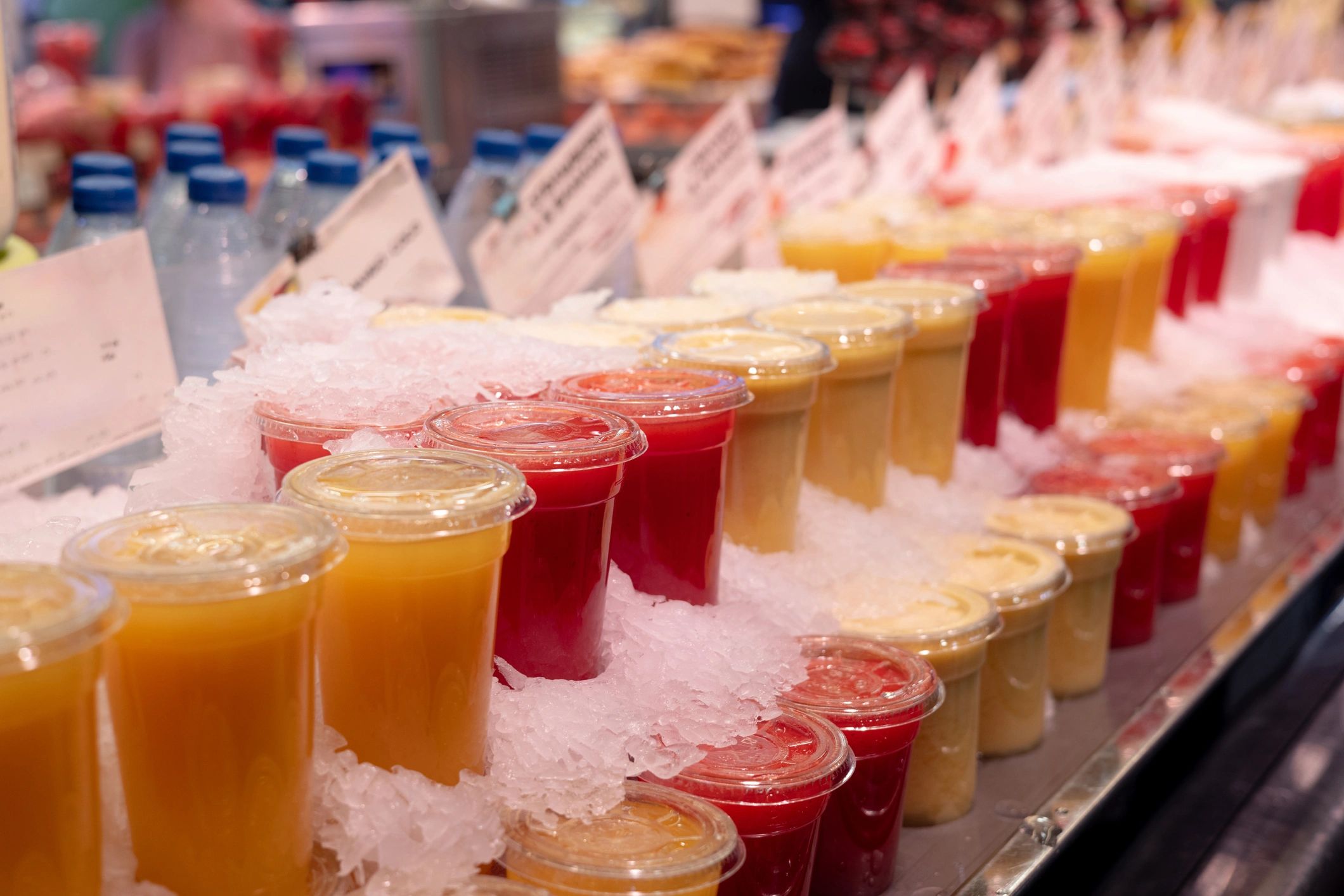 Assorted fresh fruit smoothies on ice