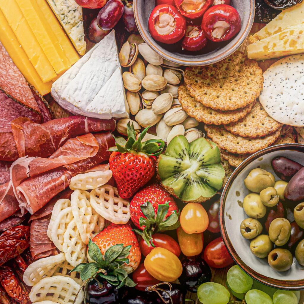 Event snack and drink pack flat lay with assorted snacks and non-alcoholic beverages