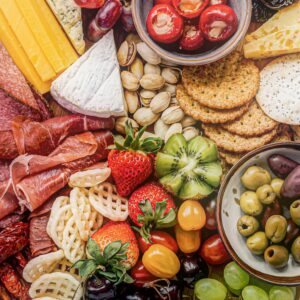 Event snack and drink pack flat lay with assorted snacks and non-alcoholic beverages